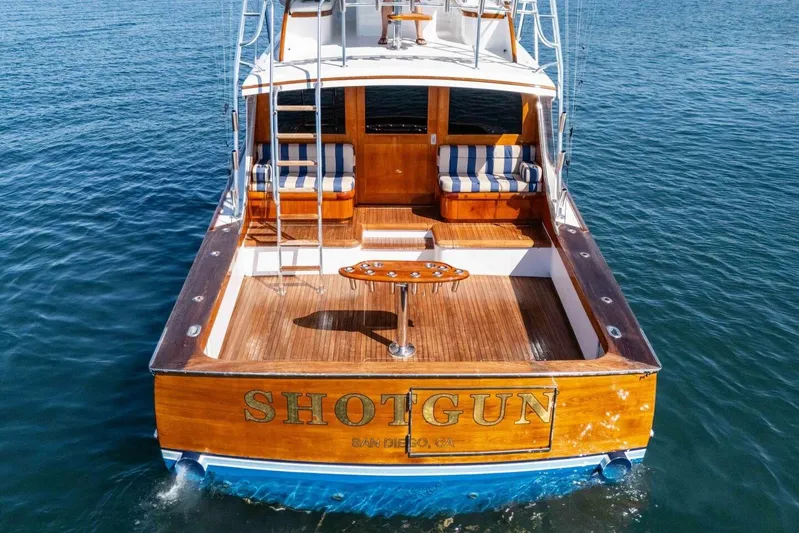 Shotgun Yacht Photos Pics 1981 Merritt 55 c yacht "Shotgun" with wooden deck, docked in San Diego waters.