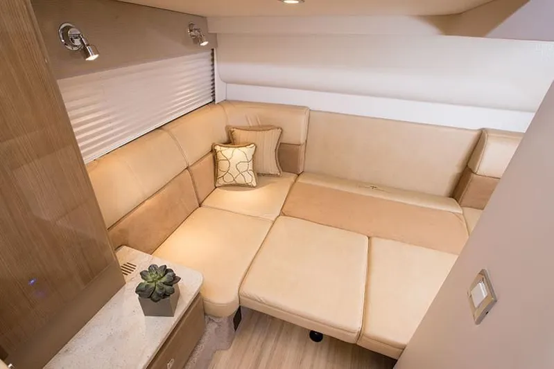 Anything For Me Too Yacht Photos Pics 2014 Formula 37 Cruiser interior with beige seating and modern decor.
