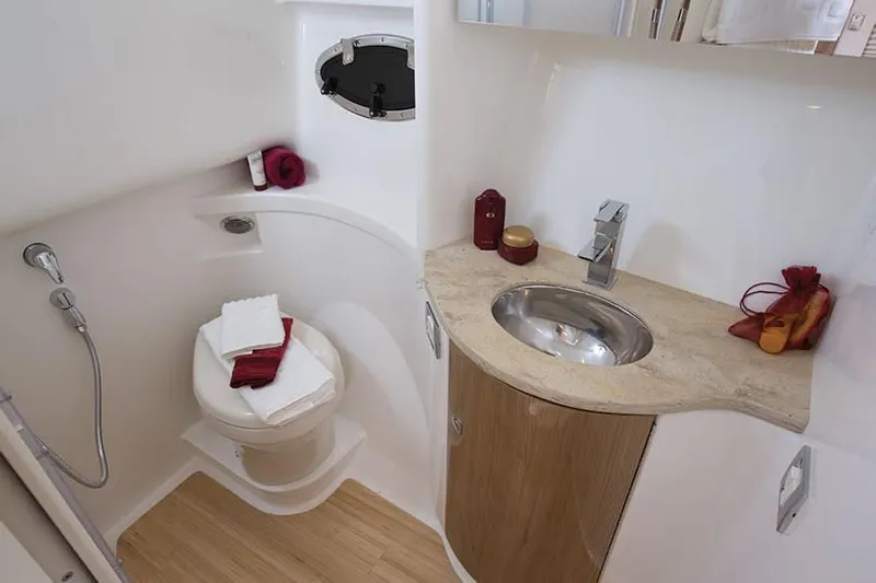 Anything For Me Too Yacht Photos Pics 2014 Formula 37 Cruiser bathroom with modern fixtures and wooden accents.