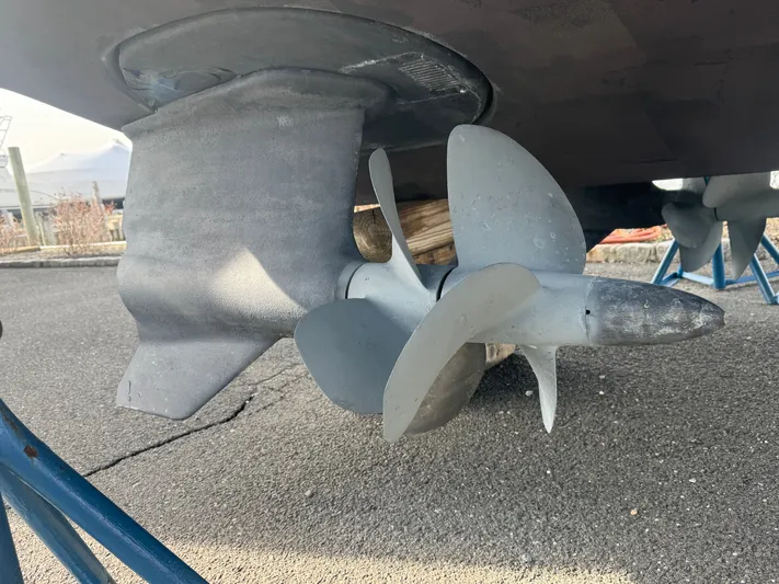 Anything For Me Too Yacht Photos Pics Propeller of a 2014 Formula 37 Performance Cruiser on a parking lot.