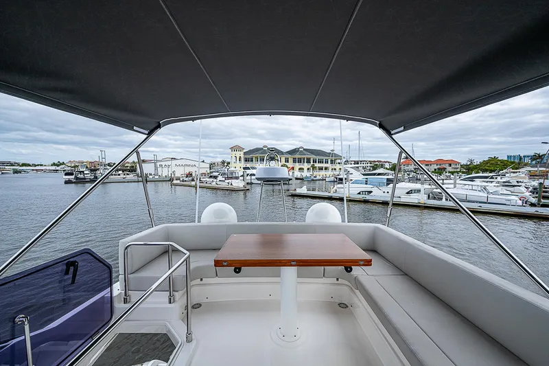 Time Chaser Yacht Photos Pics Flybridge view from 2021 Ferretti Yachts 500, overlooking marina with moored boats.