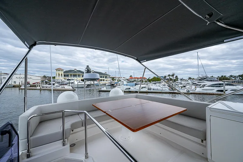 Time Chaser Yacht Photos Pics Ferretti Yachts 500, 2021 model, featuring a luxurious deck with marina view.