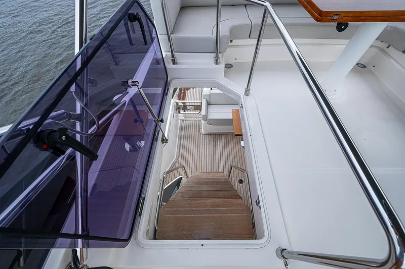 Time Chaser Yacht Photos Pics 2021 Ferretti Yachts 500 interior staircase with modern design and wooden steps.