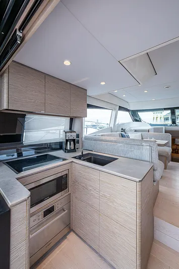 Time Chaser Yacht Photos Pics Modern kitchen interior on 2021 Ferretti Yachts 500, featuring sleek cabinetry and appliances.