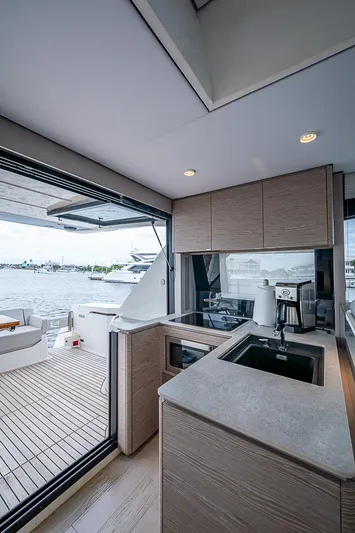Time Chaser Yacht Photos Pics Modern kitchen on 2021 Ferretti Yachts 500 with ocean view and sleek design.