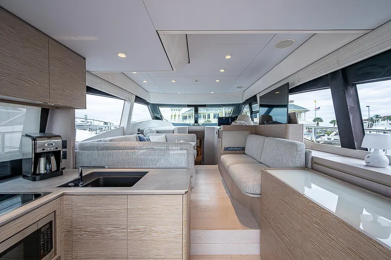 Time Chaser Yacht Photos Pics Luxurious interior of 2021 Ferretti Yachts 500, featuring modern kitchen and seating area.