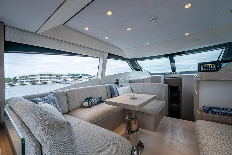 Time Chaser Yacht Photos Pics Luxurious interior of 2021 Ferretti Yachts 500 with elegant seating and panoramic windows.