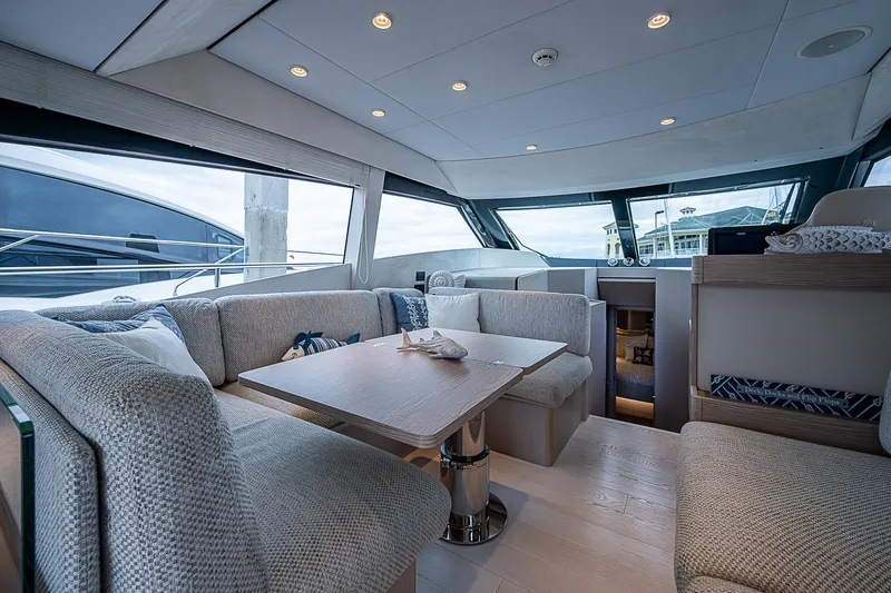 Time Chaser Yacht Photos Pics Luxurious interior of 2021 Ferretti Yachts 500, featuring elegant seating and modern design.