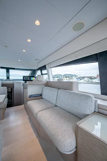 Time Chaser Yacht Photos Pics Interior of 2021 Ferretti Yachts 500, featuring modern seating and large windows.