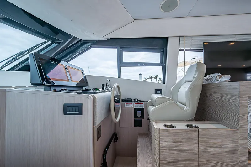 Time Chaser Yacht Photos Pics Interior helm of 2021 Ferretti Yachts 500 with modern controls and seating.