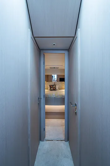 Time Chaser Yacht Photos Pics Hallway leading to a luxurious bedroom in a 2021 Ferretti Yachts 500.