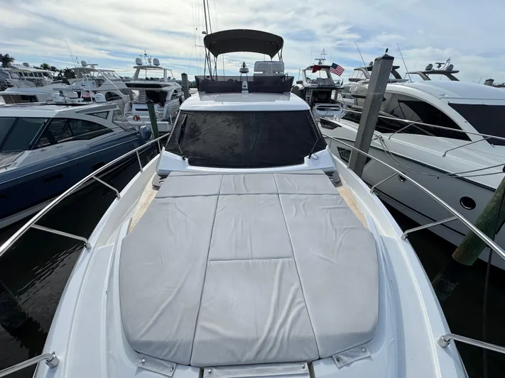 Time Chaser Yacht Photos Pics 2021 Ferretti Yachts 500 docked, featuring spacious sunbathing area and sleek design.