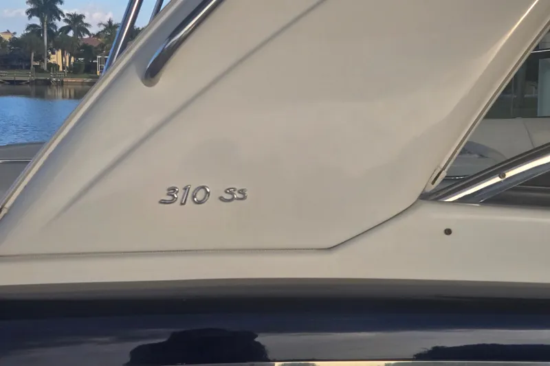 Fly Me Yacht Photos Pics 2013 Formula 310 Sun Sport boat detail with "310 SS" emblem.