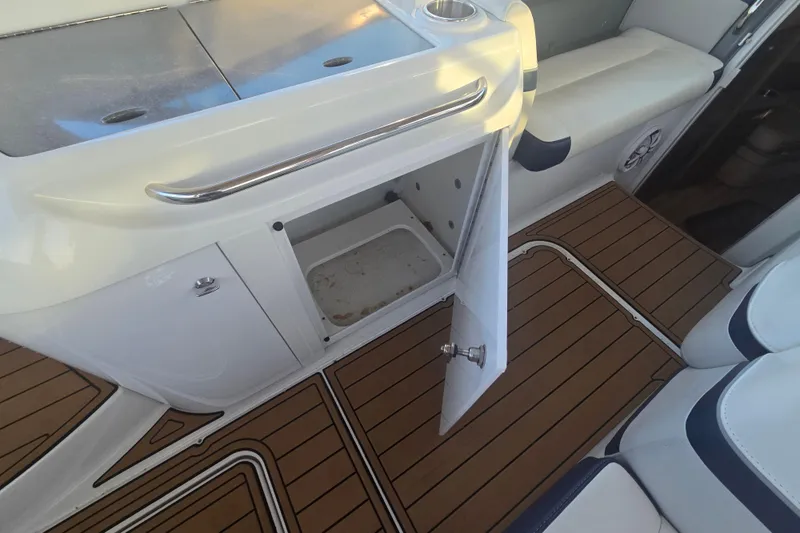 Fly Me Yacht Photos Pics 2013 Formula 310 Sun Sport boat interior with open storage compartment and teak flooring.