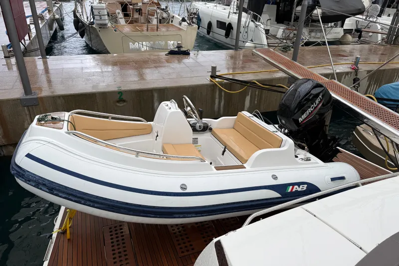  Yacht Photos Pics Luxury Prestige 620S 2016 yacht docked, featuring a sleek inflatable tender with Mercury engine.