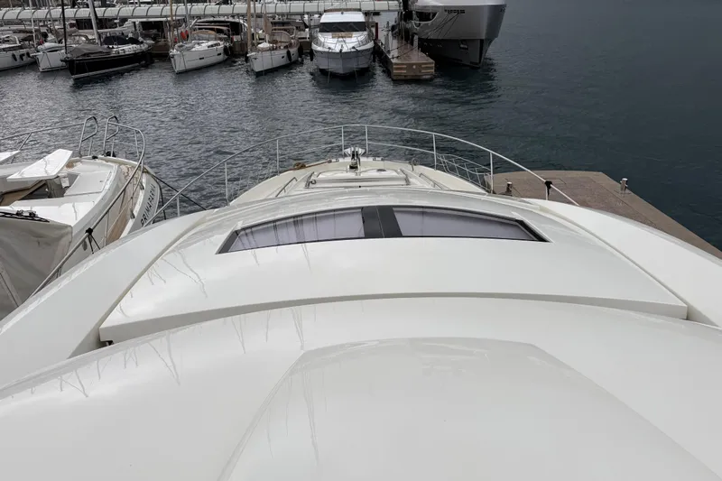  Yacht Photos Pics Luxury 2016 Prestige 620S yacht docked at marina, surrounded by other boats.
