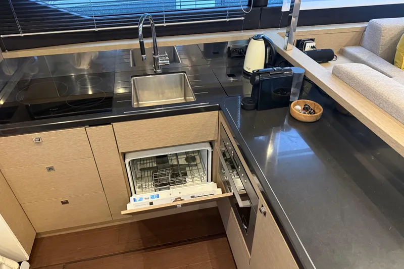  Yacht Photos Pics Modern kitchen in 2016 Prestige 620S yacht with open dishwasher and sleek appliances.