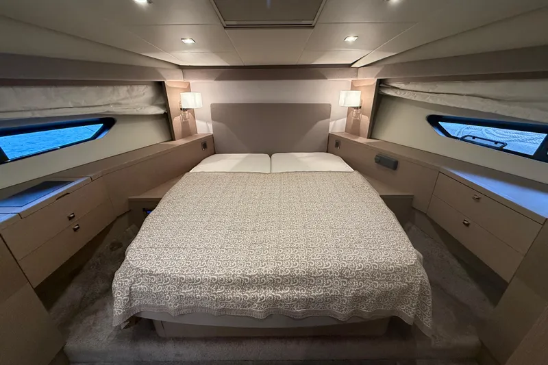  Yacht Photos Pics Luxurious bedroom interior of 2016 Prestige 620S yacht with elegant bedding and modern lighting.