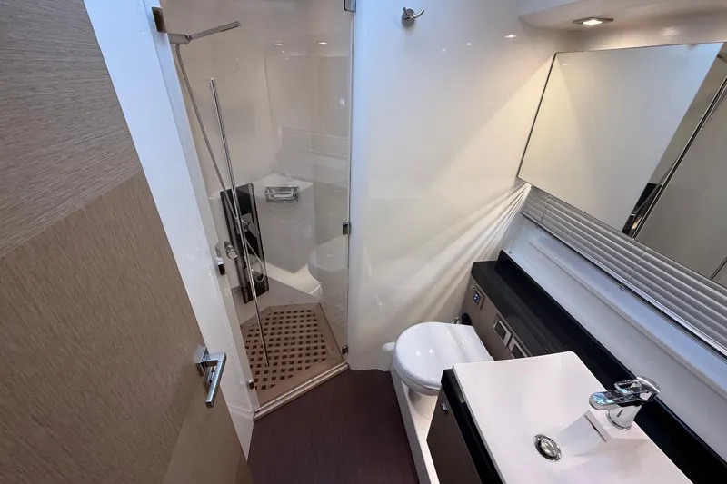  Yacht Photos Pics Luxurious bathroom interior of 2016 Prestige 620S yacht with modern fixtures and shower.