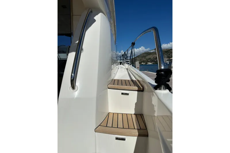  Yacht Photos Pics Staircase on 2016 Prestige 620S yacht with sleek railing and wooden steps.