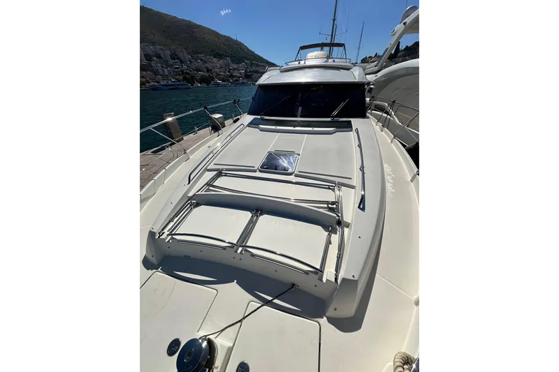  Yacht Photos Pics 2016 Prestige 620S yacht docked, showcasing sleek design and spacious deck.