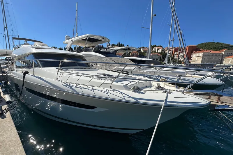  Yacht Photos Pics Luxury 2016 Prestige 620S yacht docked in a sunny marina.