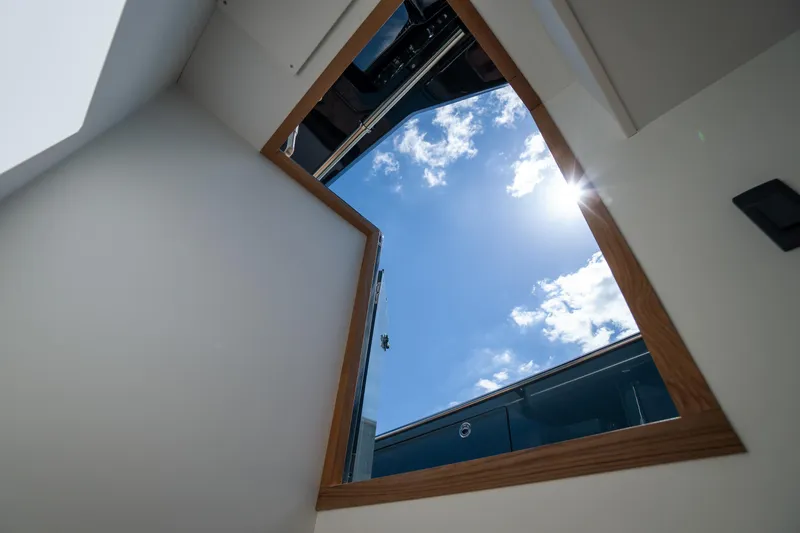 Available Now Yacht Photos Pics View through a Pardo Yachts 50 skylight, showcasing a sunny sky, 2025 model.