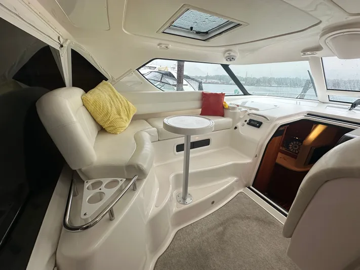 Scoutabout Yacht Photos Pics Interior of a 2007 Tiara Yachts Sovran with white seating and cushions.