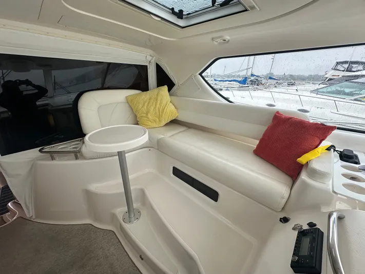 Scoutabout Yacht Photos Pics Interior of a 2007 Tiara Yachts Sovran with seating area and cushions.