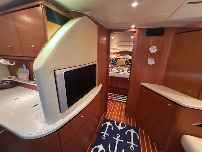 Scoutabout Yacht Photos Pics Interior of a 2007 Tiara Yachts Sovran with wooden cabinetry.