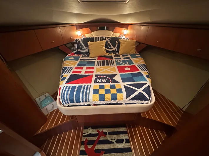 Scoutabout Yacht Photos Pics Interior of a 2007 Tiara Yachts Sovran with nautical-themed bedding.