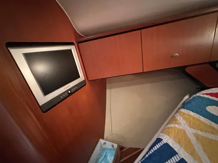Scoutabout Yacht Photos Pics Interior of a 2007 Tiara Yachts Sovran with TV and cabinets.