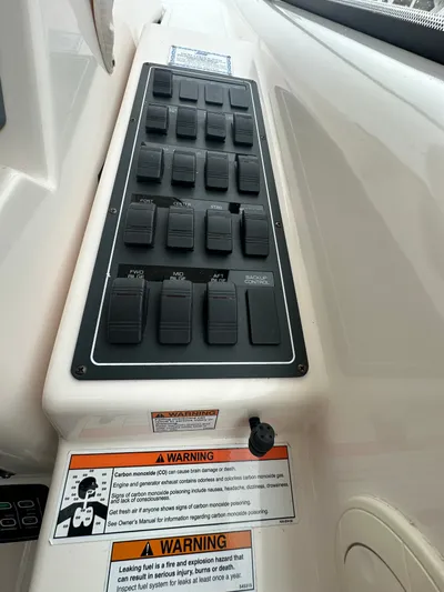 Scoutabout Yacht Photos Pics Control panel of 2007 Tiara Yachts Sovran with warning labels.