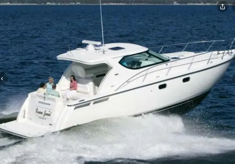 Scoutabout Yacht Photos Pics 2007 Tiara Yachts Sovran cruising on the sea with passengers.