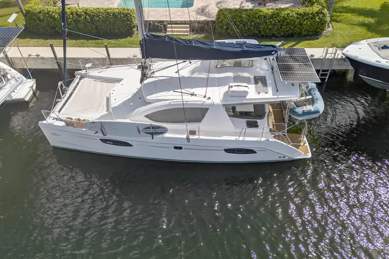Papillon Yacht Photos Pics 2012 Leopard 39 catamaran docked, featuring solar panels and spacious deck.