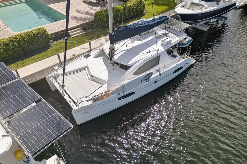 Papillon Yacht Photos Pics Aerial view of 2012 Leopard 39 catamaran docked near a pool and solar panels.