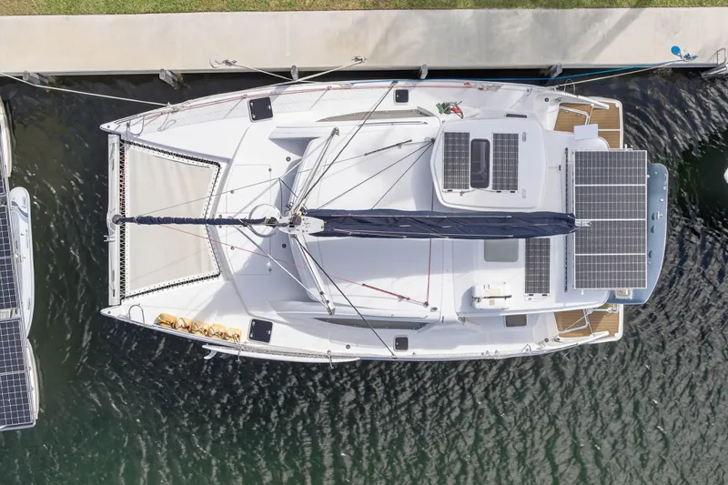 Papillon Yacht Photos Pics Aerial view of 2012 Leopard 39 catamaran docked, featuring solar panels and spacious deck.