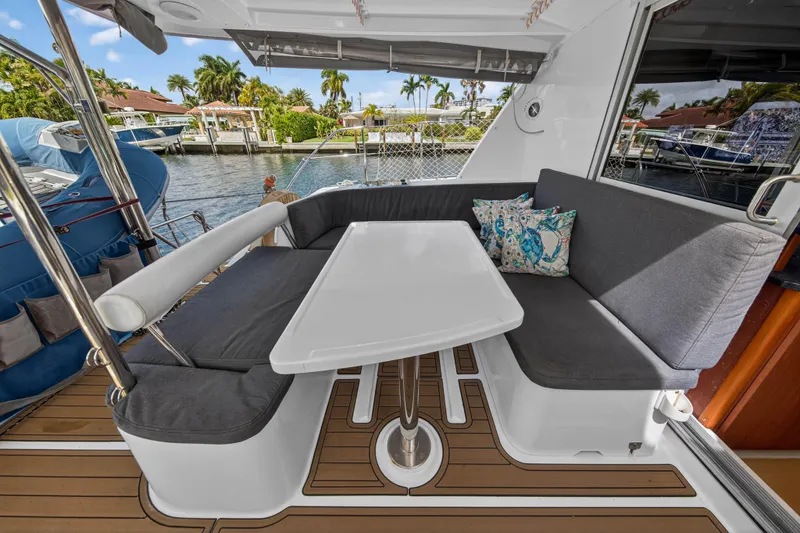 Papillon Yacht Photos Pics Cozy seating area on a 2012 Leopard 39 yacht with a waterfront view.