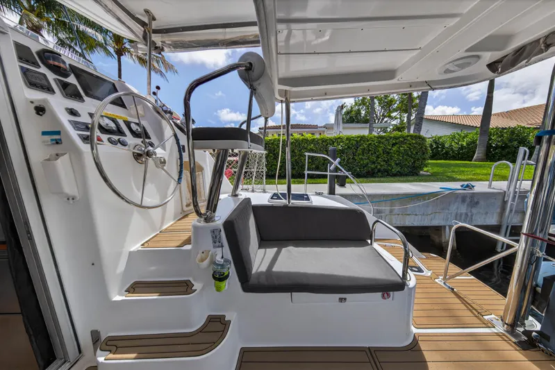 Papillon Yacht Photos Pics Cockpit of 2012 Leopard 39 yacht with steering wheel and seating area.