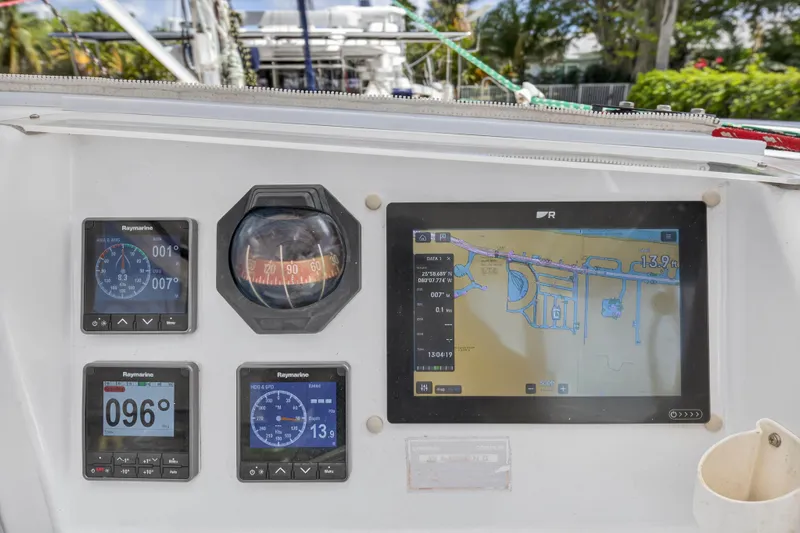 Papillon Yacht Photos Pics Control panel of a 2012 Leopard 39 sailboat with navigation instruments and digital display.