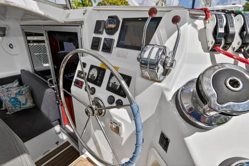 Papillon Yacht Photos Pics Steering wheel and controls of a 2012 Leopard 39 yacht cockpit.