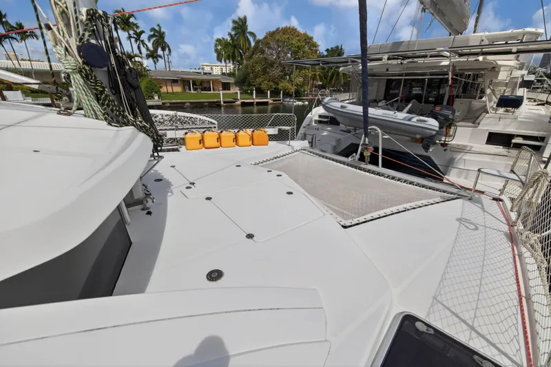 Papillon Yacht Photos Pics Deck view of a 2012 Leopard 39 catamaran docked, featuring netting and safety equipment.