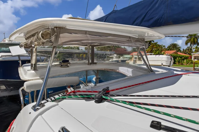 Papillon Yacht Photos Pics 2012 Leopard 39 sailboat deck with ropes and canopy, docked in a sunny marina.