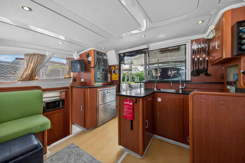 Papillon Yacht Photos Pics Interior of 2012 Leopard 39 yacht with modern kitchen and seating area.