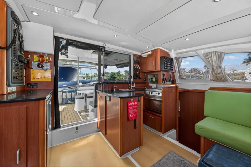 Papillon Yacht Photos Pics Interior of 2012 Leopard 39 yacht with modern kitchen and seating area.