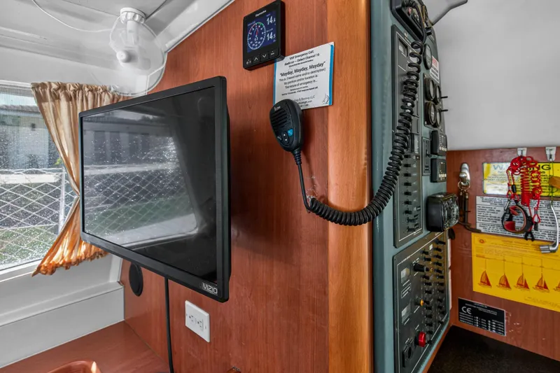 Papillon Yacht Photos Pics Interior of 2012 Leopard 39 yacht with control panel, monitor, and communication equipment.