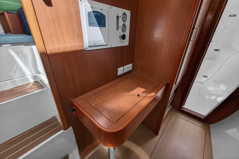 Papillon Yacht Photos Pics Interior of 2012 Leopard 39 yacht with wooden paneling and control panel.