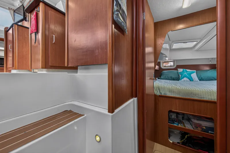 Papillon Yacht Photos Pics Interior of 2012 Leopard 39 yacht with cozy cabin and wooden cabinetry.