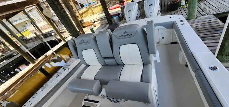  Yacht Photos Pics 2021 Regulator 31 FS boat with dual seating and sleek design.