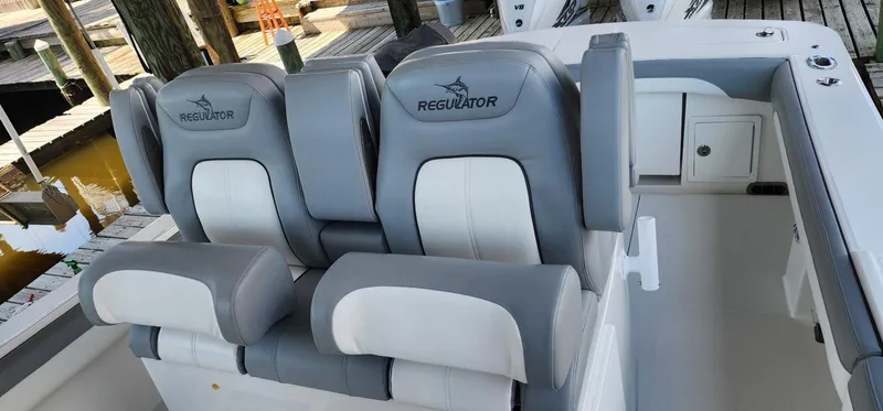  Yacht Photos Pics 2021 Regulator 31 FS boat seats, gray and white upholstery, docked.